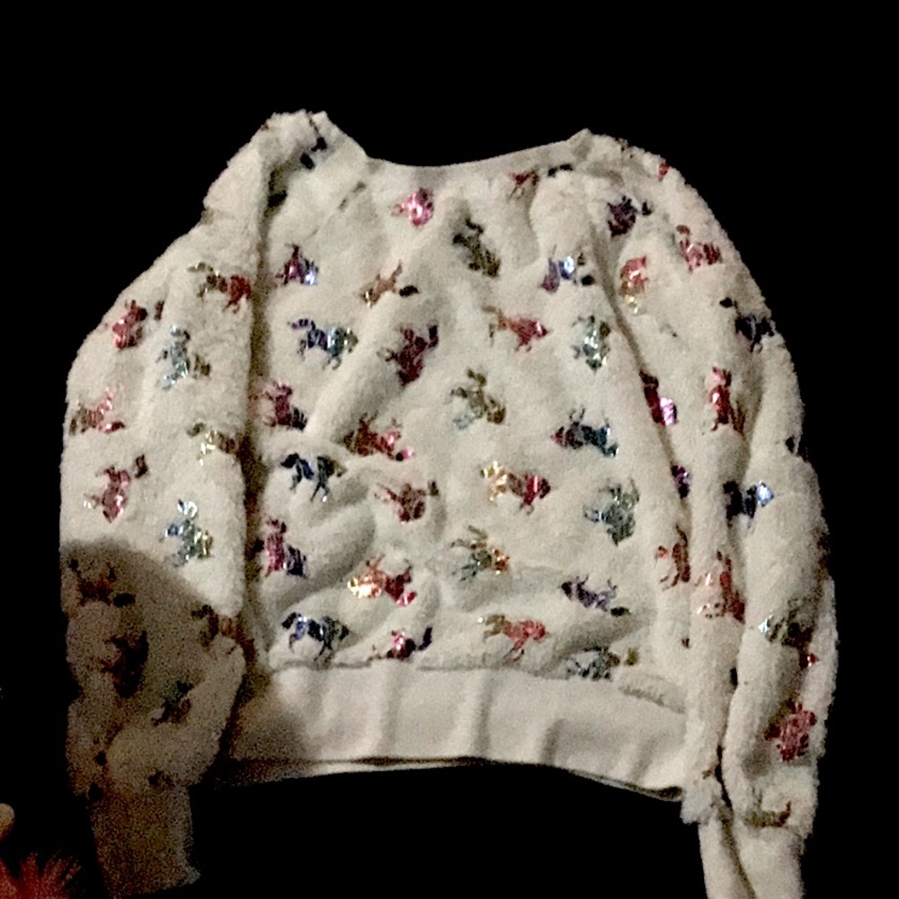This is white and it has rainbow unicorn on it